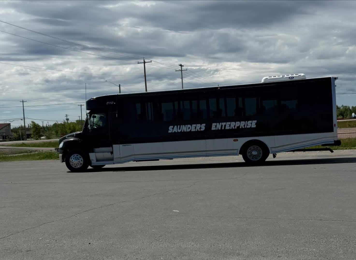 Image of Saunders Enterprise black bus added to their fleet